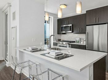 European-style, frameless espresso cabinetry